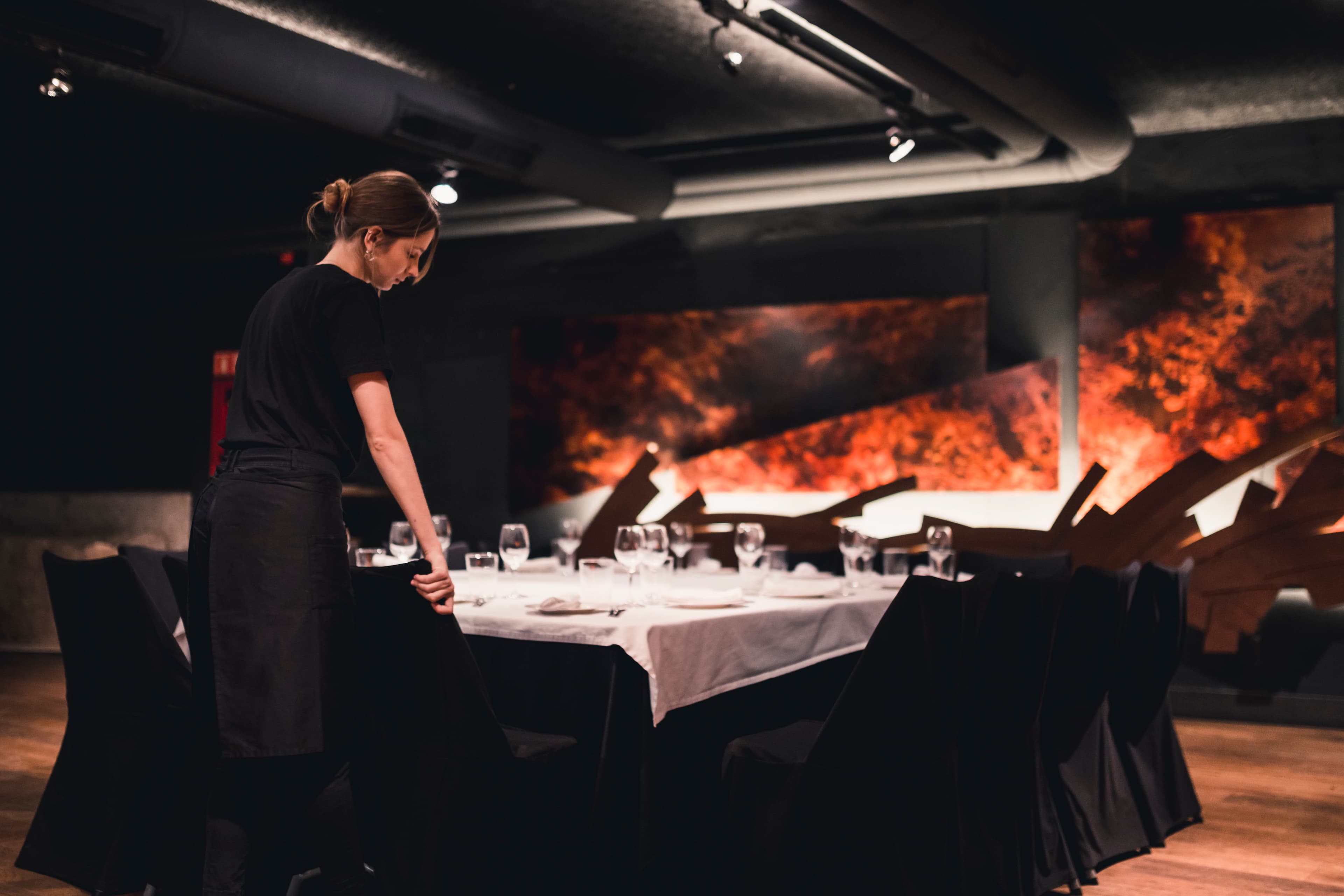 Hostess arranging chairs